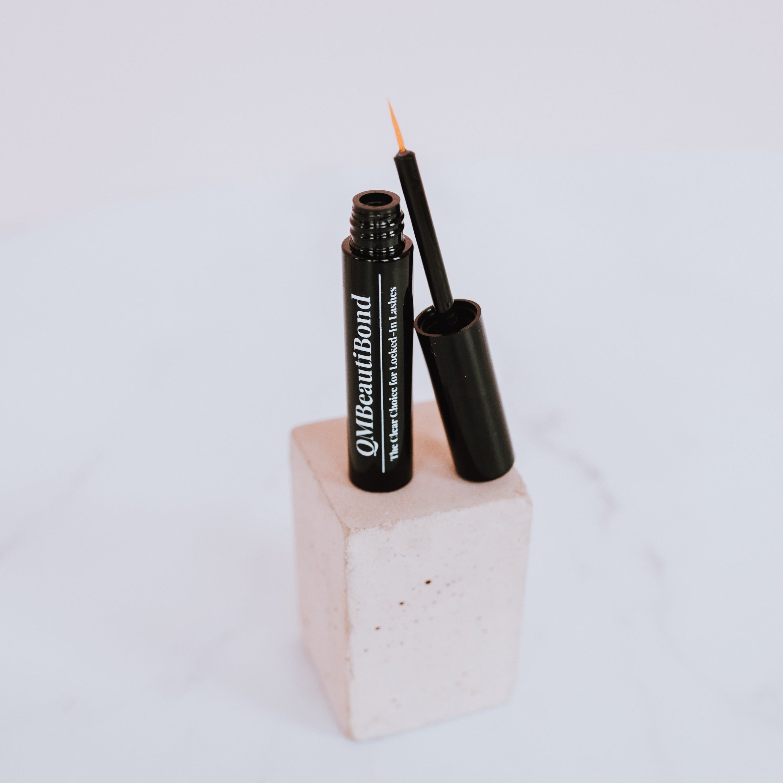Clear Liquid Eyeliner Eyelash Adhesive. Clear Liquid Eyeliner (False Eyelash Adhesive). Applies like a liquid eyeliner along the lash line to connect false lashes. Leaping Bunny Certified. Paraben, Phthalate and Fragrance Free. Vegan.